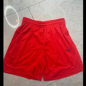 Red Nike athletic shorts